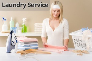 Laundry ironing - woman folding clothes
