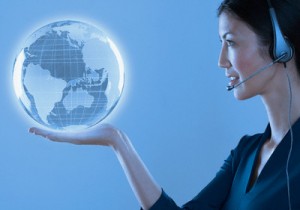 Woman with headset holding a globe